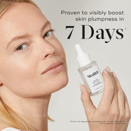 A woman holds a bottle of Liquid Peptides serum. Text on the right states, "Proven to visibly boost skin plumpness in 7 Days*." A footnote states this is from an independent consumer study.