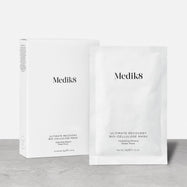 A white product carton for Ultimate Recovery Bio-Cellulose Mask stands next to a single white sachet of the mask.