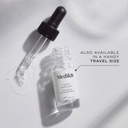 A small clear glass bottle (8mL) of Medik8 Liquid Peptides serum, with its dropper resting beside it. Text indicates it's "ALSO AVAILABLE IN A HANDY TRAVEL SIZE.